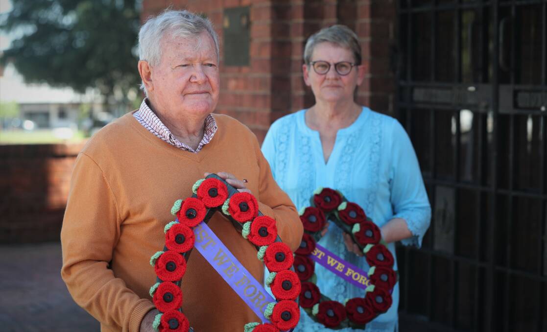 PAYING RESPECTS: David Mills [president] and Jenny Booker [secretary] from the Bathurst RSL Sub Branch. Photo: PHIL BLATCH