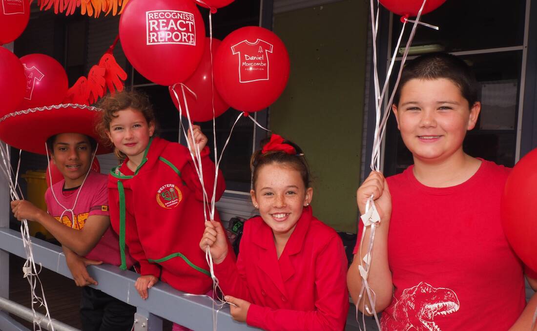 RED FOR DANIEL: Perthville P.S. students Lenard McDaid [Year 6], Holly McPhail [Year 1], Sophie Soetens [Year 4] and Marcus Harper [Year 6]. Photo: SAM BOLT